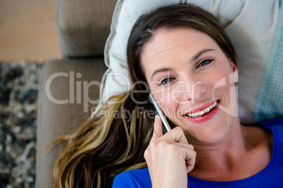 smiling woman making a phone call on her mobile