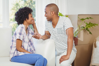 handsome man offering engagement ring to his girlfriend