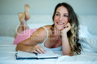 smiling woman reading n a book
