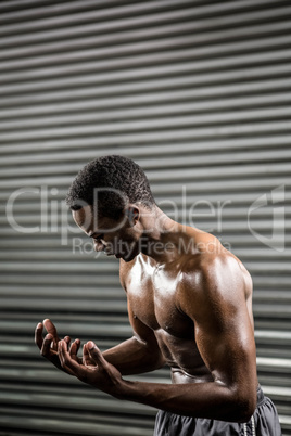 Shirtless man shouting