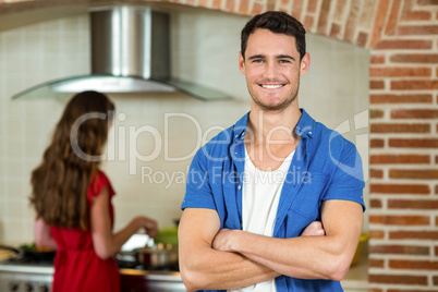 Portrait of young man smiling in kitchen