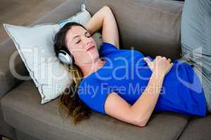 smiling woman asleep with headphones on
