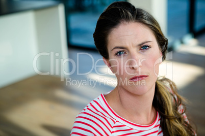 woman staring into the camera unhappily
