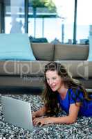 smiling woman on her laptop