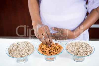Pregnant woman taking almond