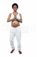 Pregnant woman doing yoga exercise
