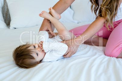 cute baby lying on a bed