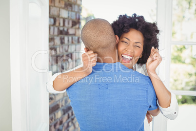 Happy couple embracing and cheering