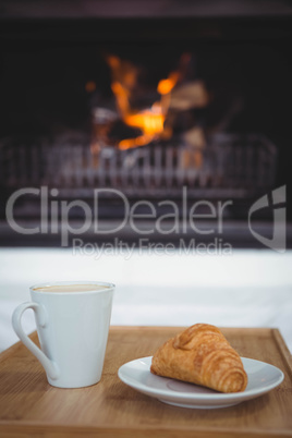 View of coffee and croissant on a table