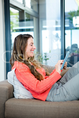 smiling woman on her tablet