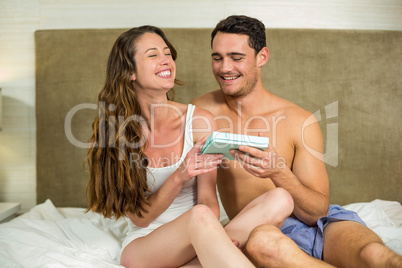 Man giving a surprise gift to woman