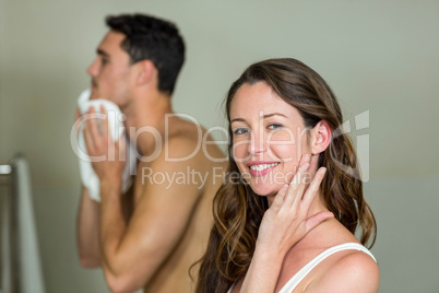 Couple in front of bathroom mirror