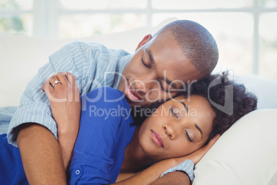 Peaceful couple sleeping on the sofa