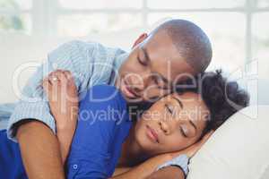 Peaceful couple sleeping on the sofa