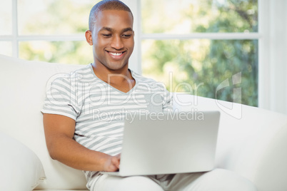 Handsome man using laptop