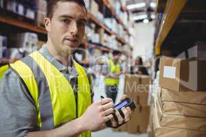 Warehouse worker scanning box