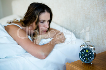 angry woman lying in bed