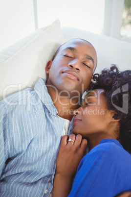 Peaceful couple sleeping on the sofa