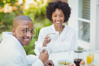 Happy couple having breakfast