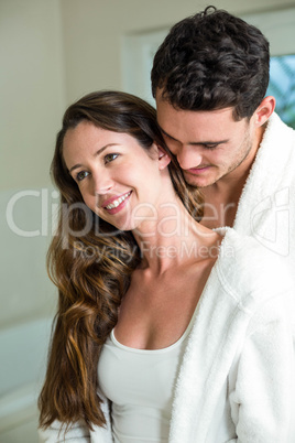 Young couple embracing in bathroom