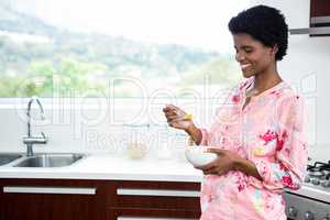 Pregnant woman eating fruit salad