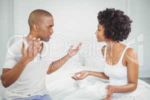 Couple having argument in bedroom