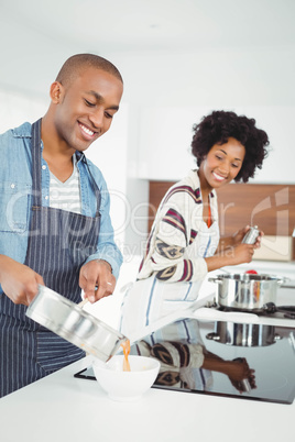 Happy couple cooking together