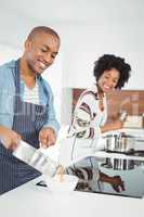 Happy couple cooking together