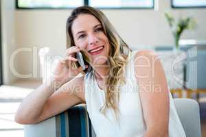 smiling woman making a phone call