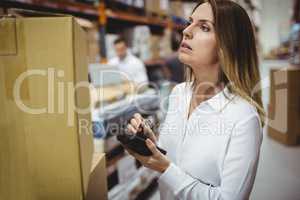 Serious woman looking at box