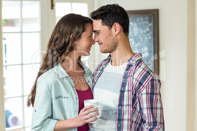 Happy couple having a cup of coffee