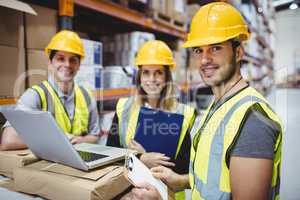 Portrait of smiling warehouse managers