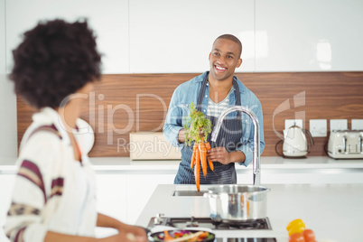 Happy couple preparing meal