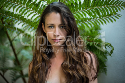 Portrait of beautiful woman standing outdoors in garden