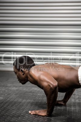 Shirtless man doing push up