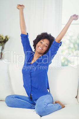 Portrait of smiling woman on the sofa