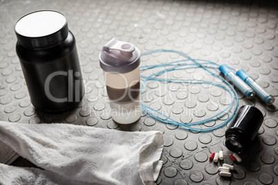 Supplements and rope on the floor