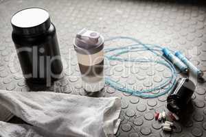 Supplements and rope on the floor