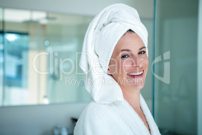 woman wearing a dressing gown smiling at the camera