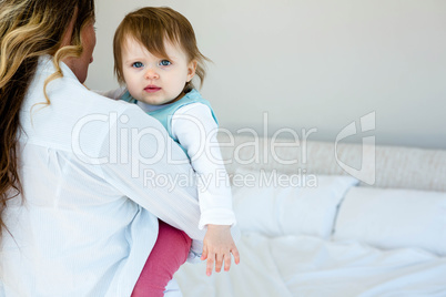 smiling woman holding an adorable baby