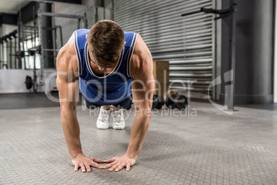 Muscular man doing push up