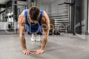 Muscular man doing push up