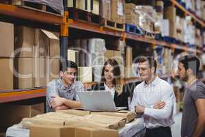 Portrait of smiling warehouse managers