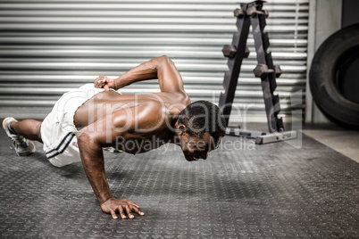 Shirtless man doing push up