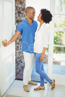 Happy couple about to open the door