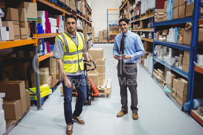 Manager and worker pulling trolley