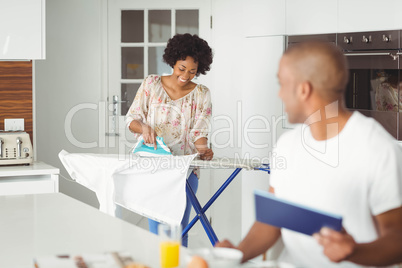 Young man using tablet in kitchen