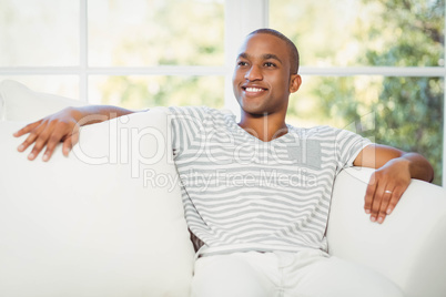 Handsome man sitting on the sofa