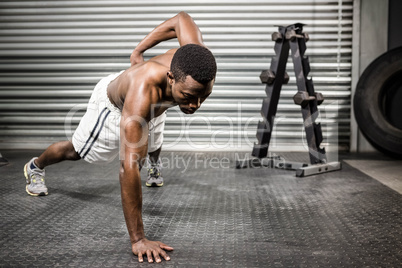 Shirtless man doing push up