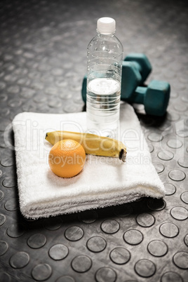 Fruit, water and dumbbells